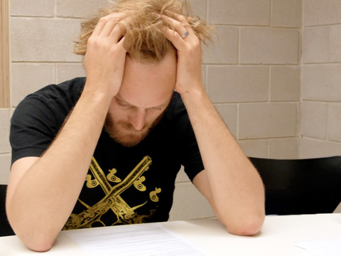 person with head in hands