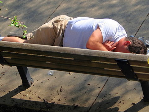 homeless man on bench