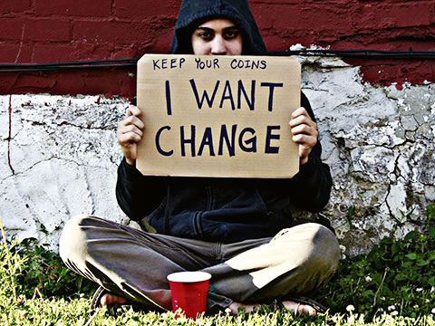 homeless man with sign